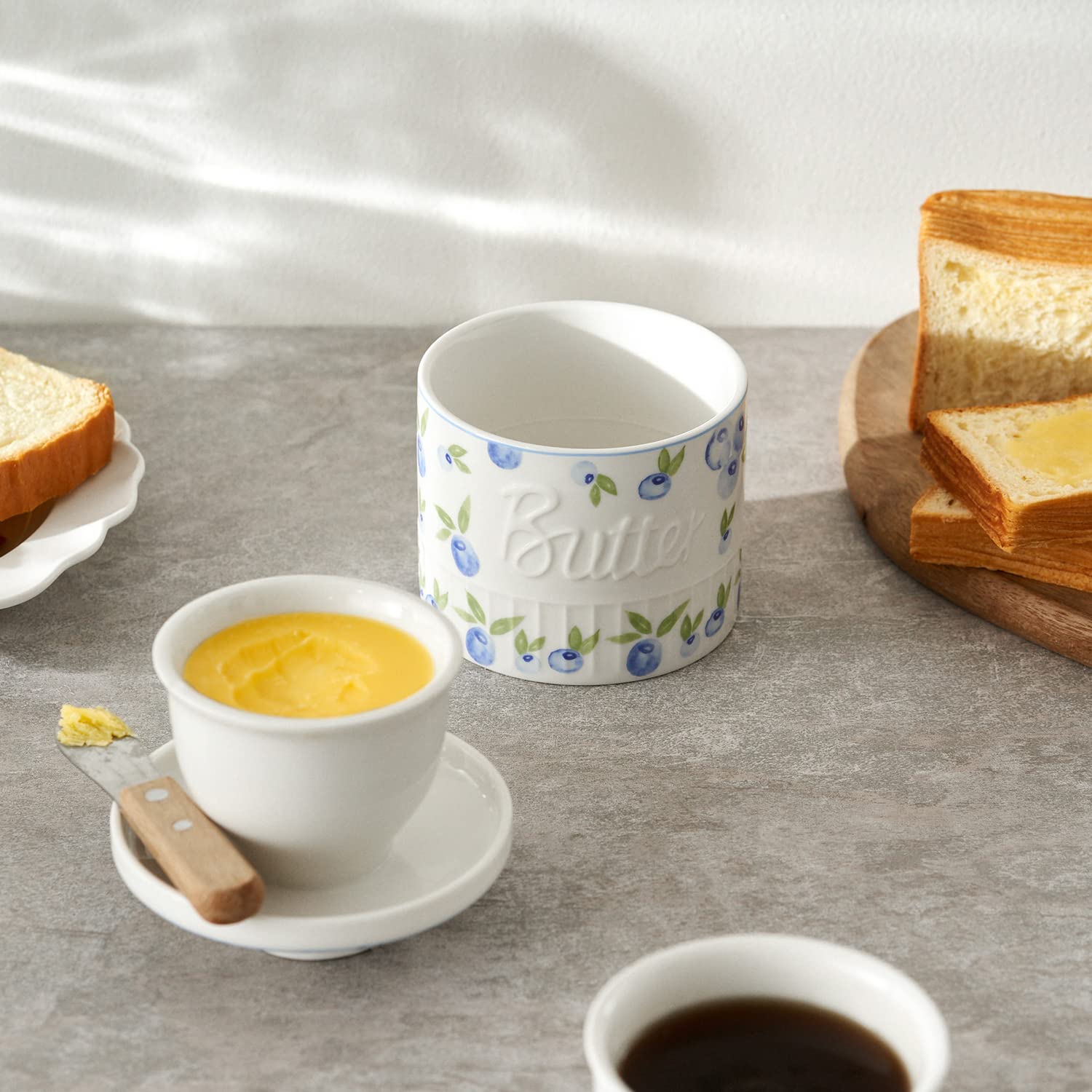 Dishwasher-safe porcelain keeps butter crock easy to care for.