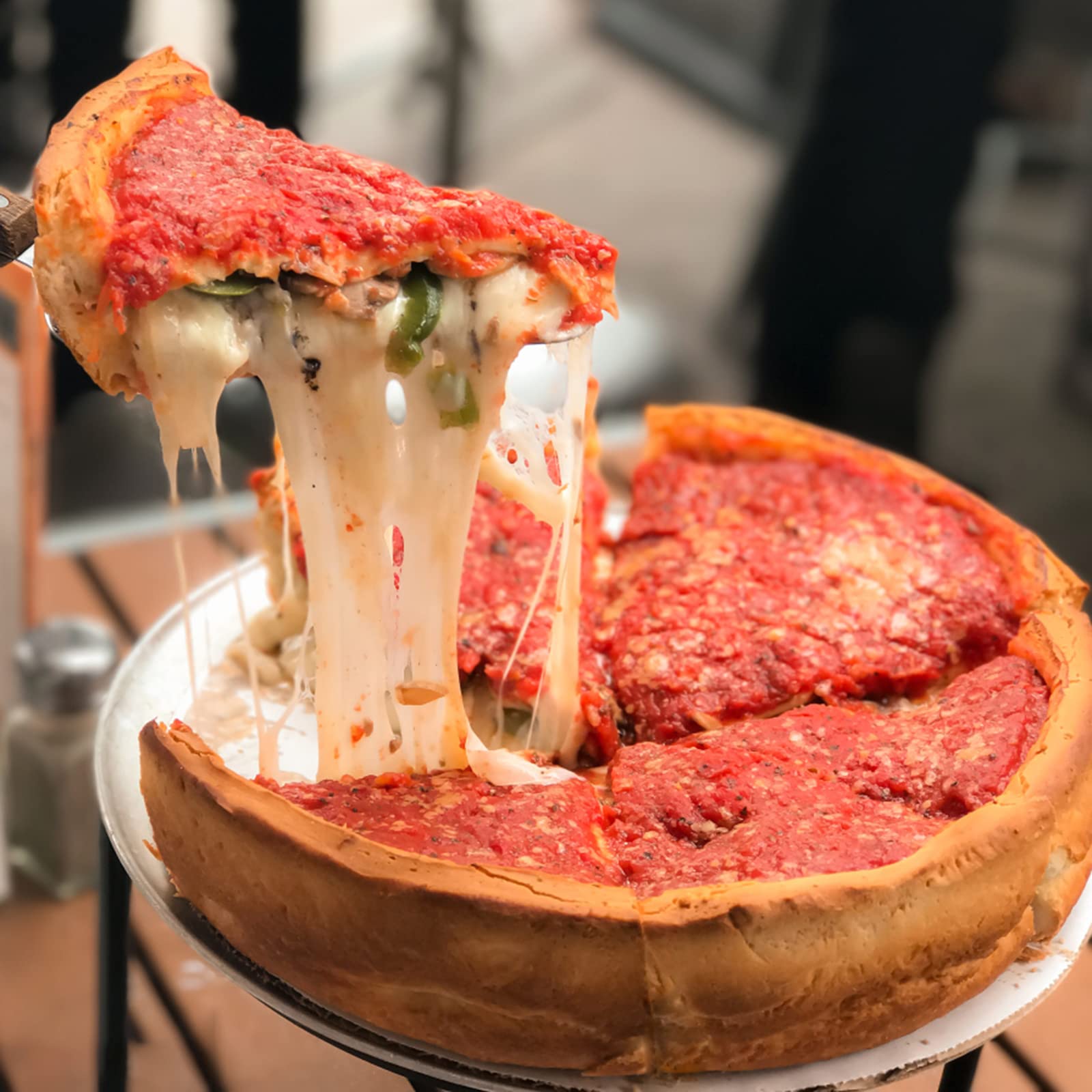 TOPZEA indoor-outdoor-use pizza-pan suited for versatile cooking venues.
