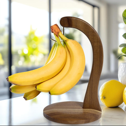 Totally Bamboo acacia wood banana hanger stand enhances kitchen decor while storing fruit.