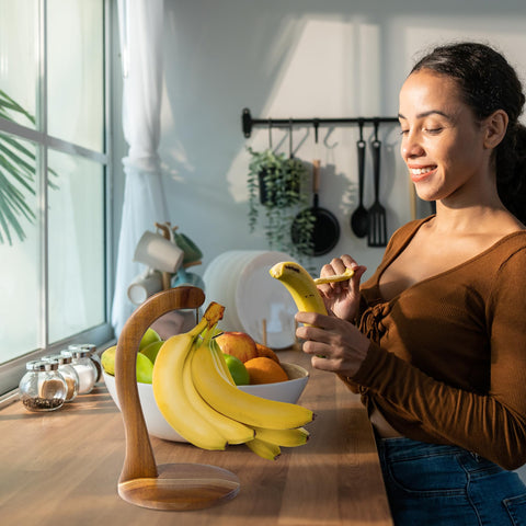 Totally Bamboo banana holder with sturdy base supports a large banana bunch.