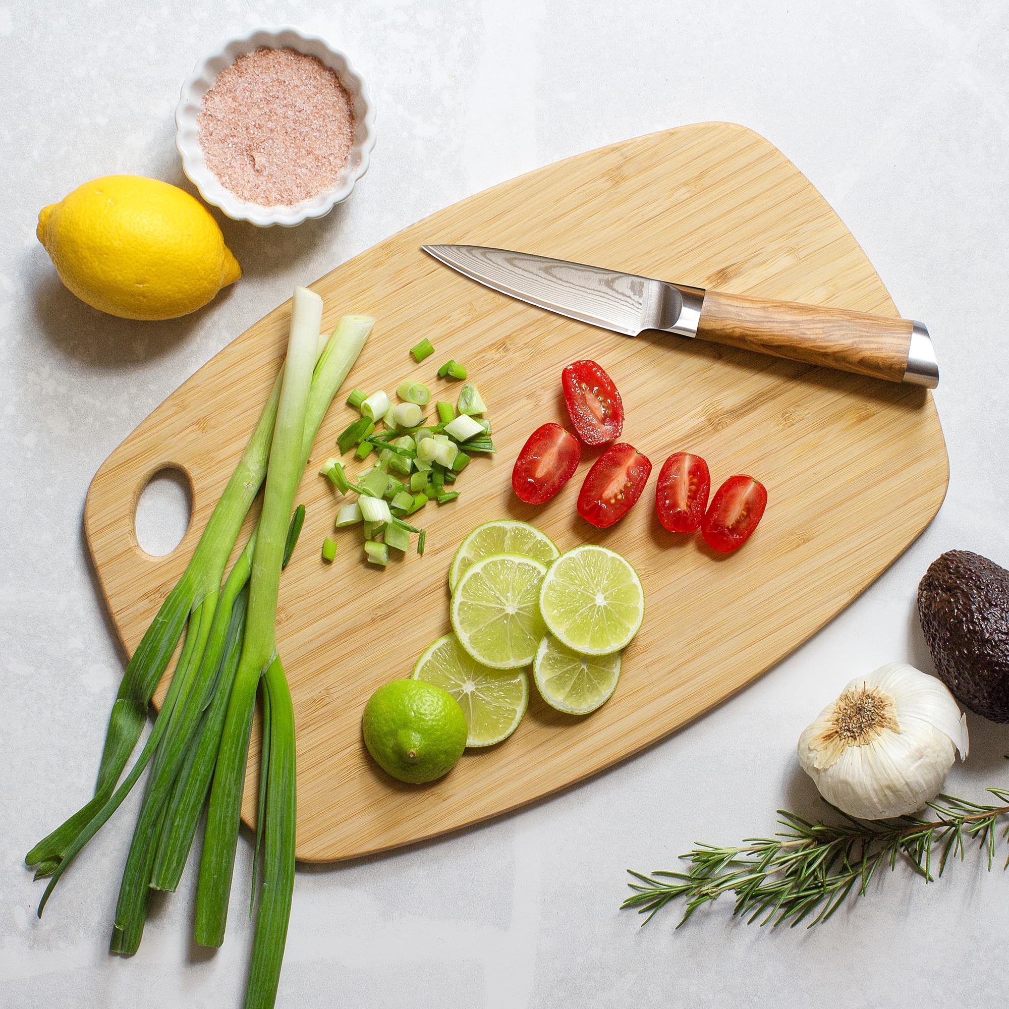 Totally Bamboo Greelite cutting board stored in a drawer, saving kitchen space.