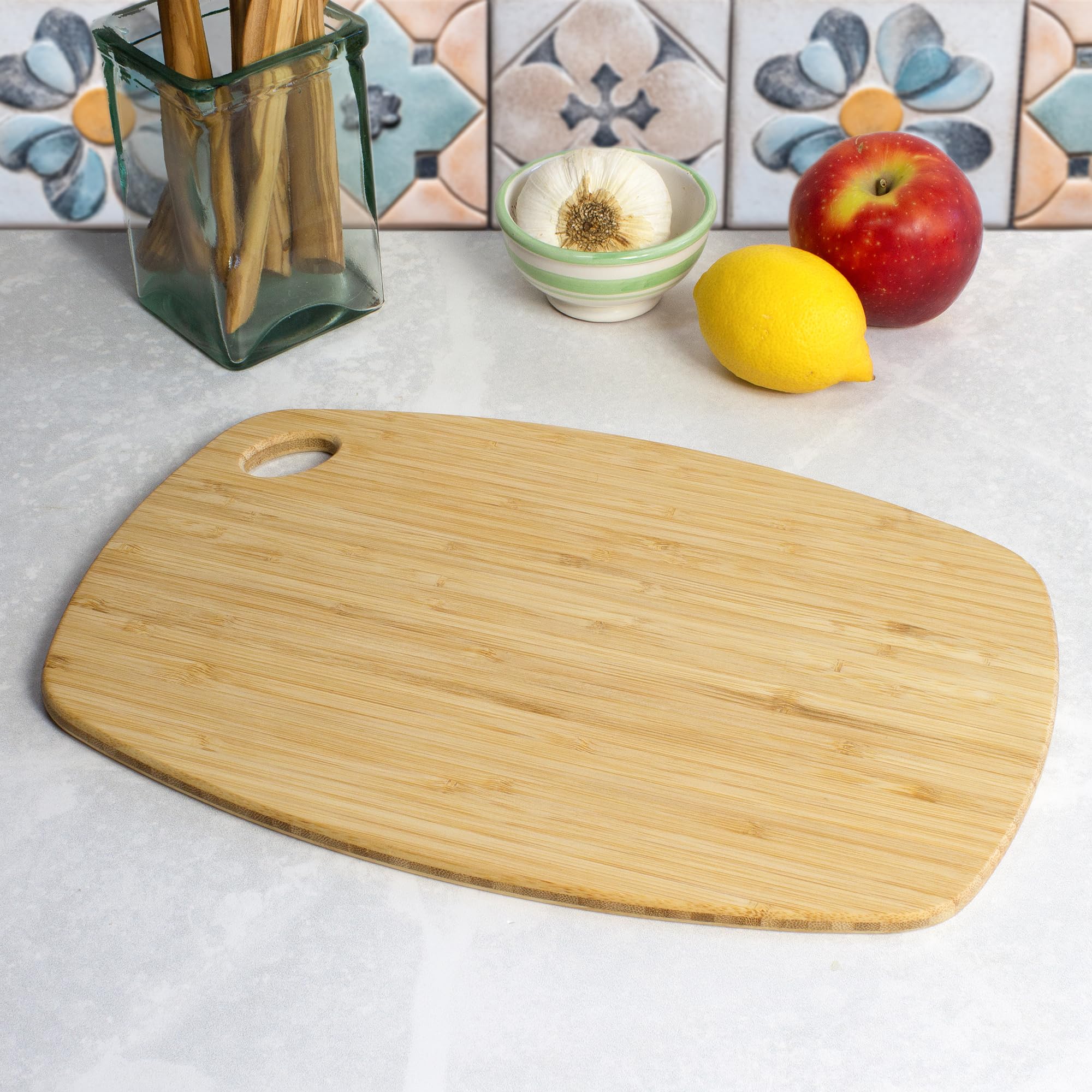 Totally Bamboo Greelite reversible cutting board showing two usable sides.