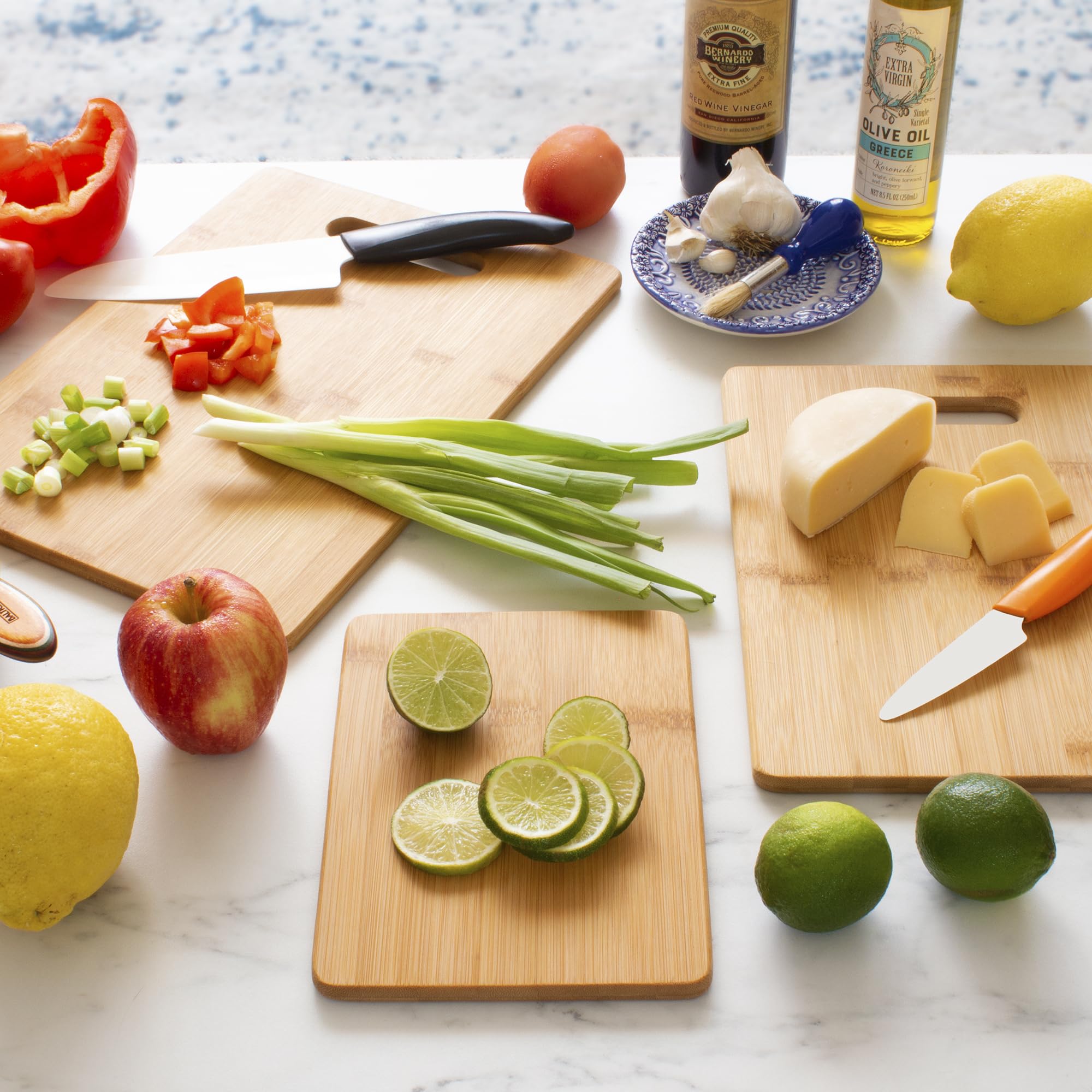 Totally Bamboo knife-friendly cutting board protects blades while chopping.