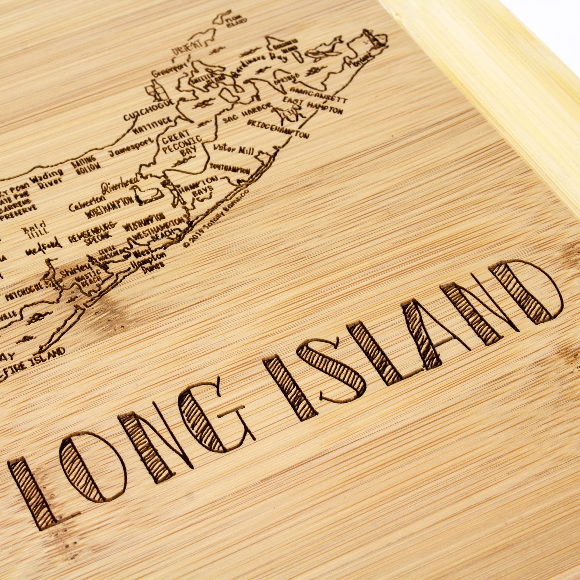 Totally Bamboo reversible cutting board provides knife-friendly surface for easy prep and serving
