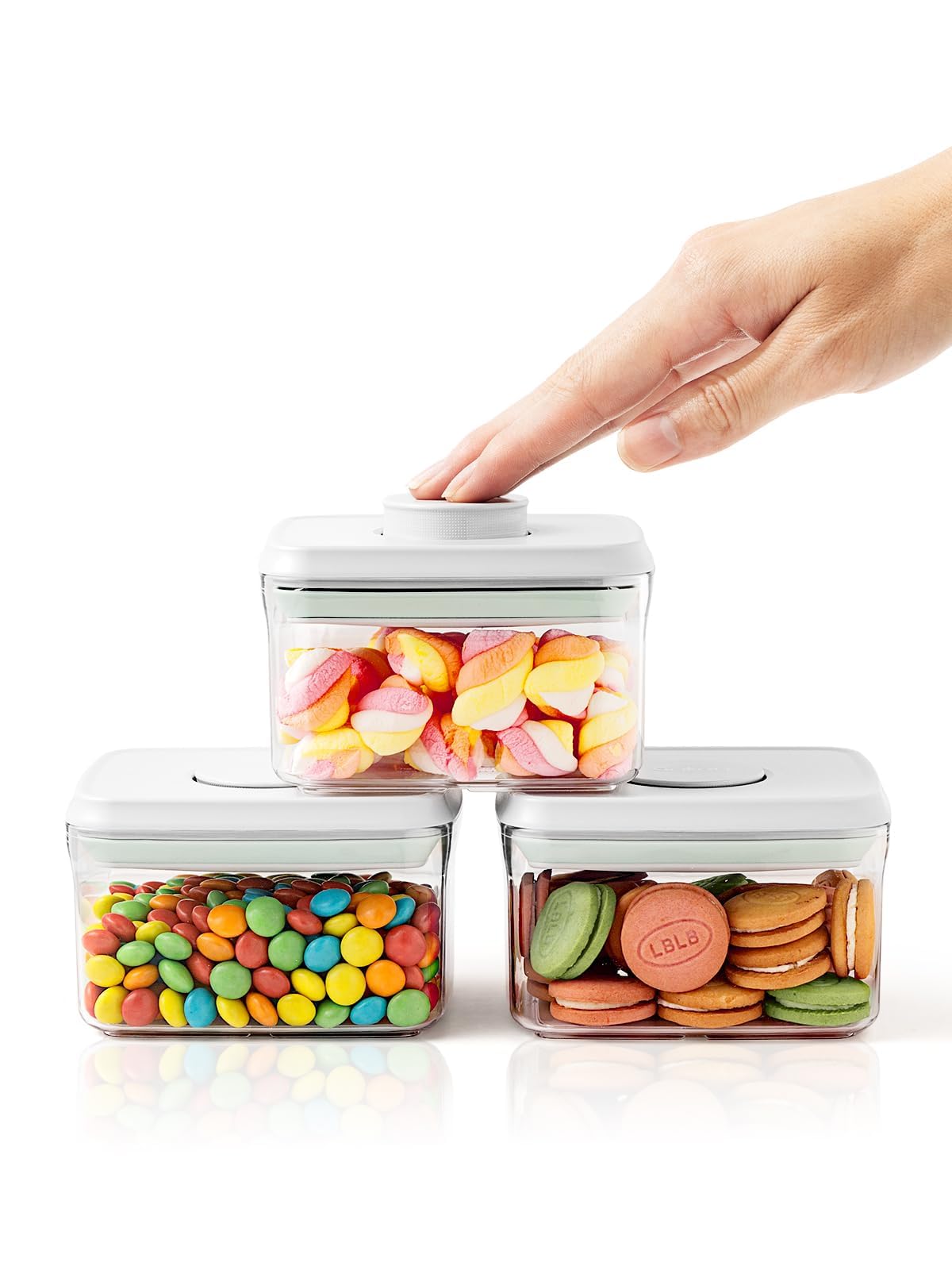 Tourdeus pop container with button lid for quick, one-handed snack access.