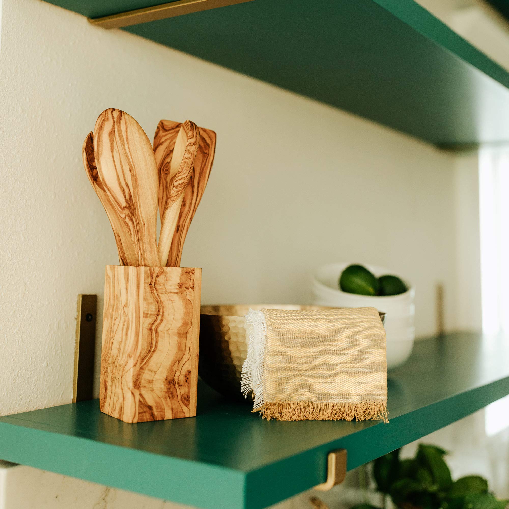 Close-up of burl grain on TRAMANTO olive wood utensil holder.