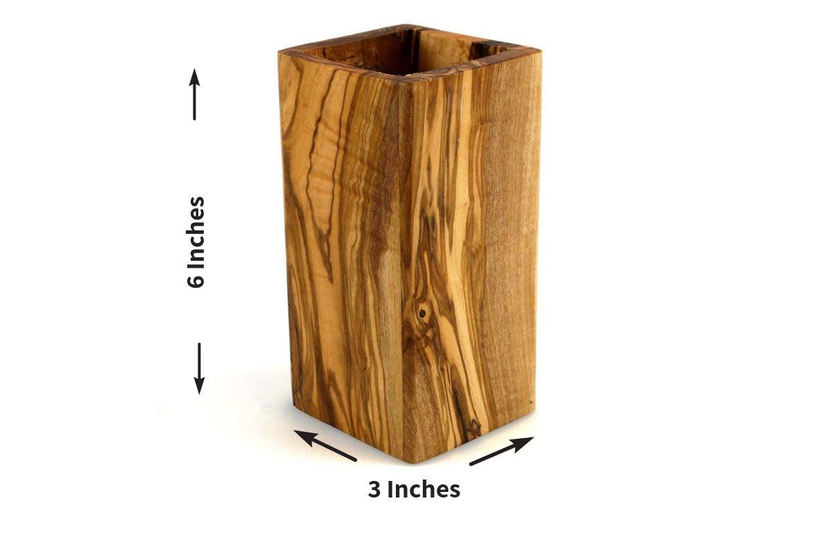 TRAMANTO olive wood utensil holder on a kitchen counter with tall spoons.