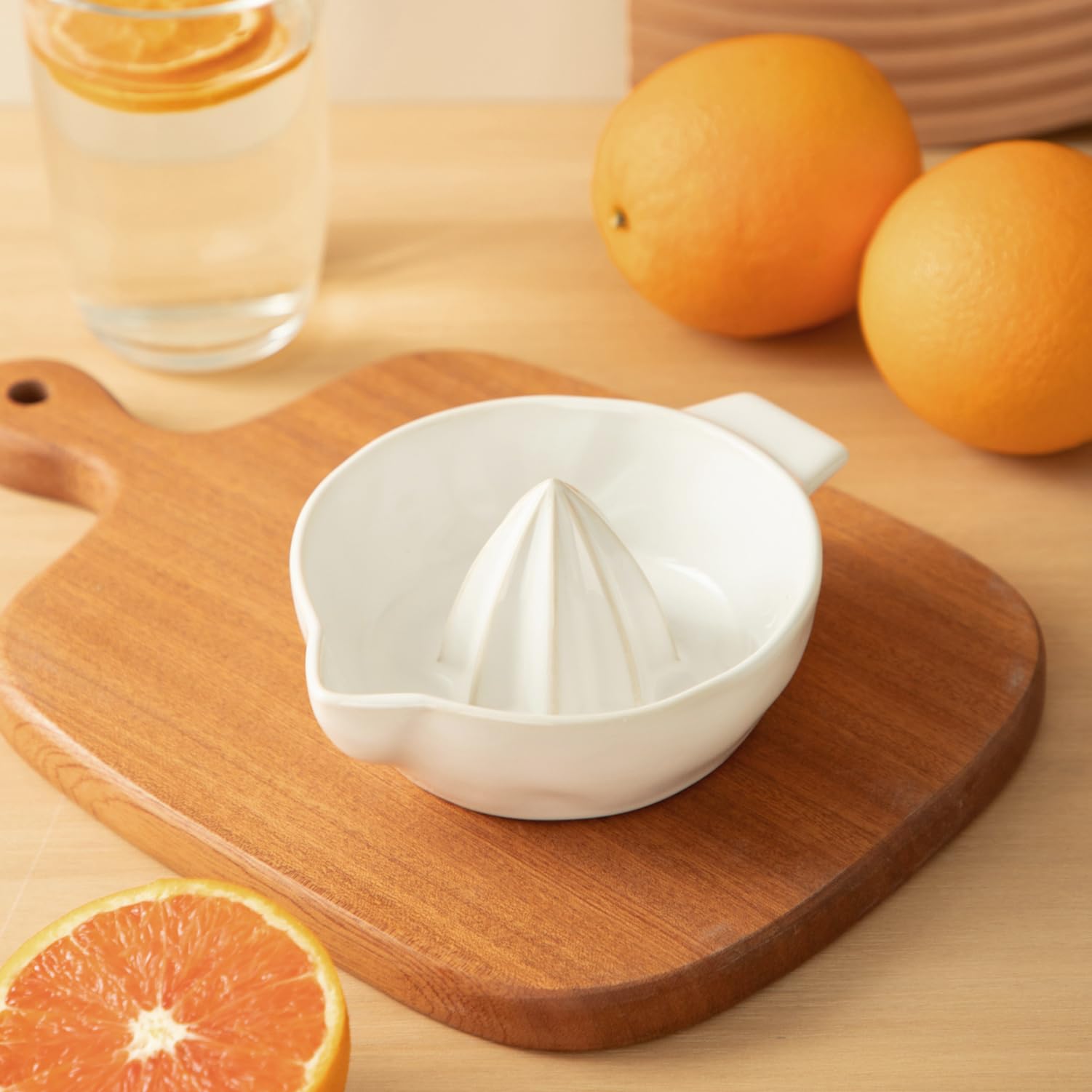 Tuioyoc lemon juicer shows a handle and pour spout for smooth transfer.