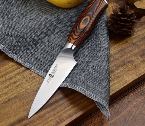 Compact TUO paring knife stored in kitchen drawer.