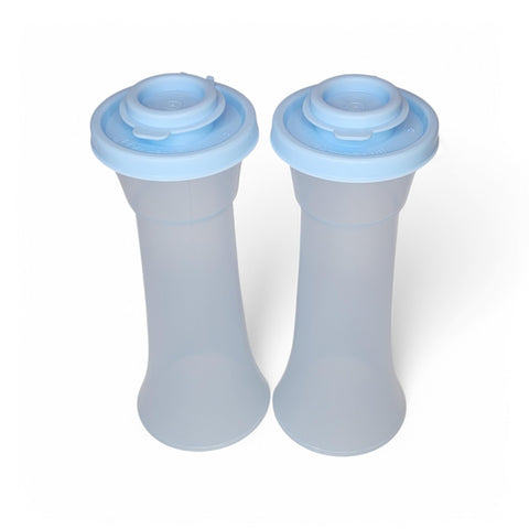 Tupperware large hourglass salt and pepper shakers in sheer ice blue with airtight seals.