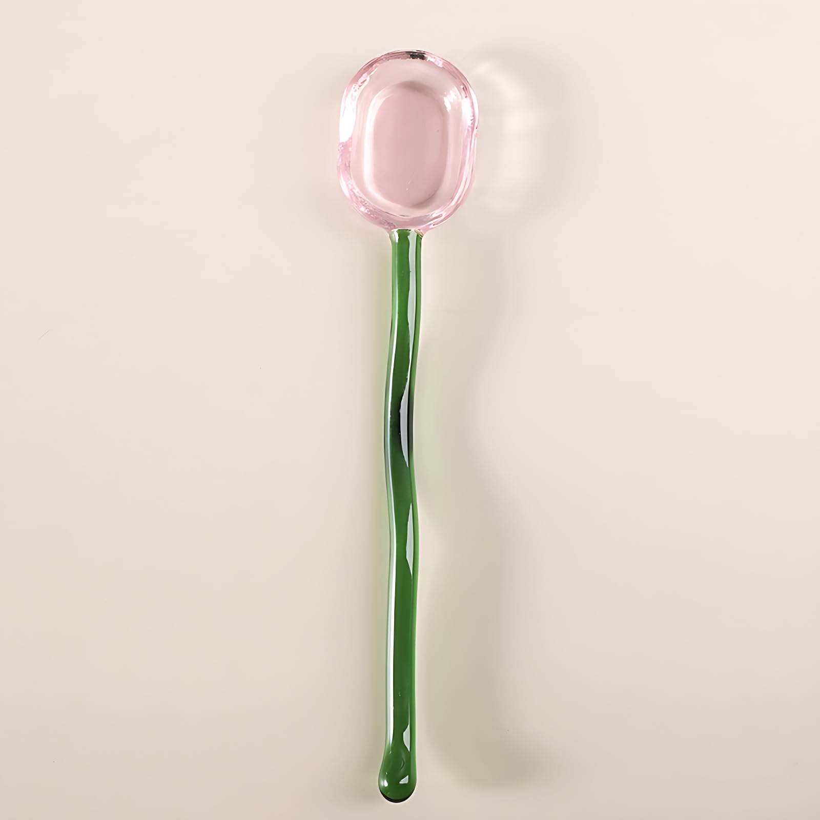 Turbokey glass spoon being used to stir sugar