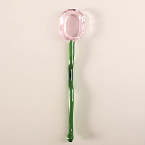 Turbokey glass spoon being used to stir sugar