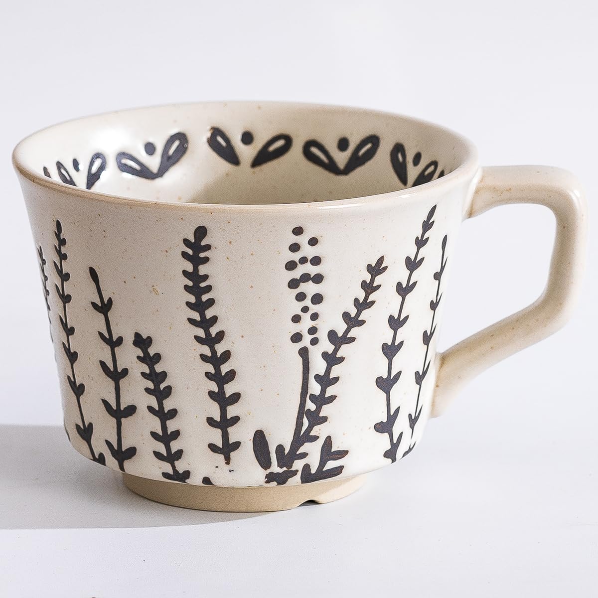 Tvvtuww ceramic mug with black leaf pattern, ideal for daily coffee or tea.