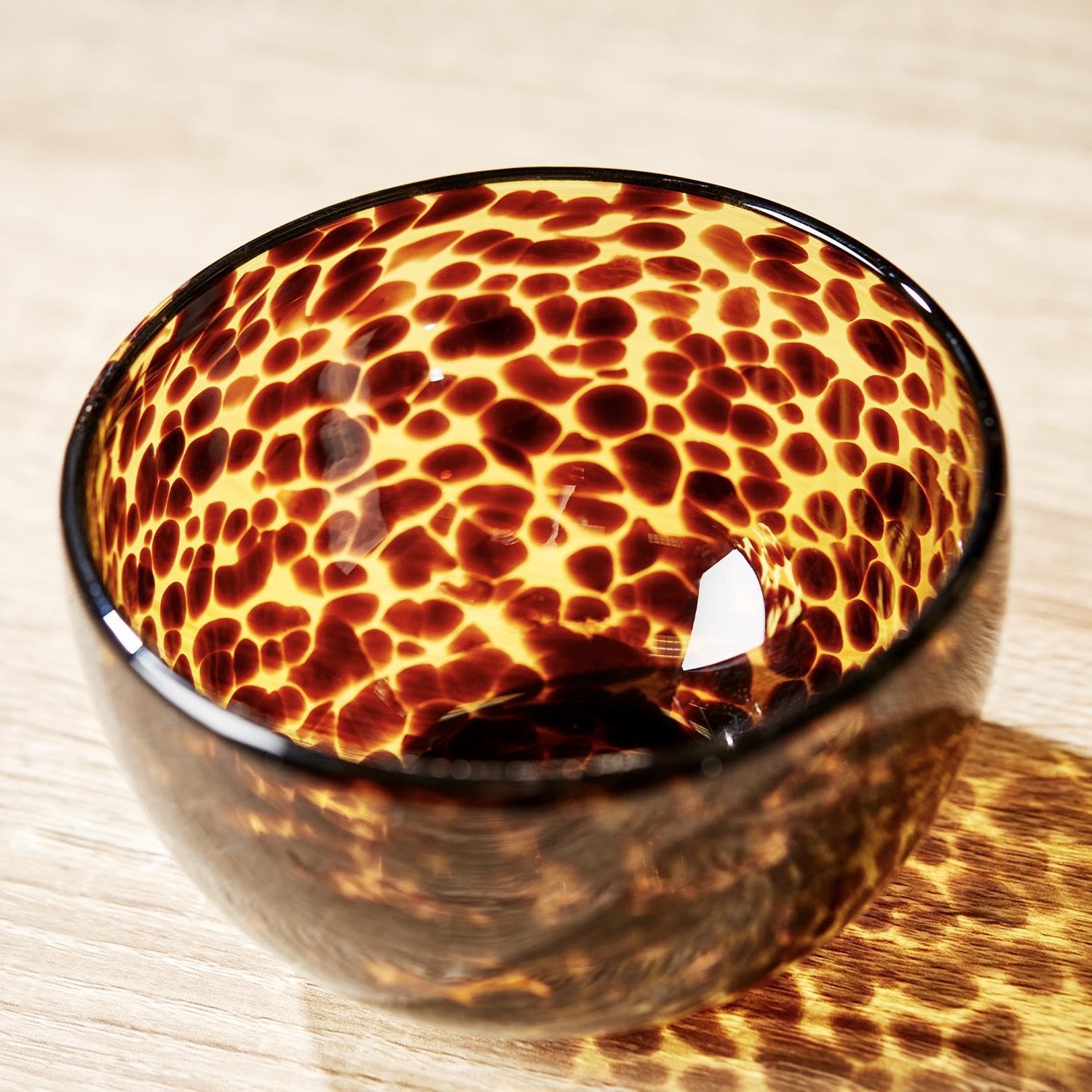 Two's Company tortoise print tidbit bowl side view, perfect for desserts.