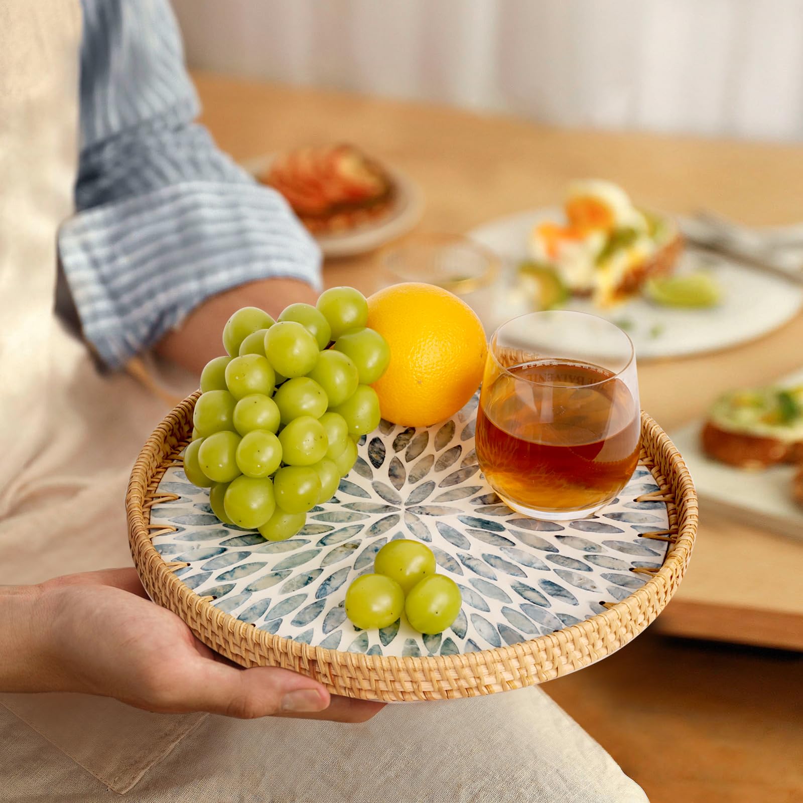 Tynulox tray displaying fruit, bread, or small snacks on a table.