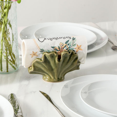 Uiddo green ceramic sponge holder on counter with sponge for quick cleanup.