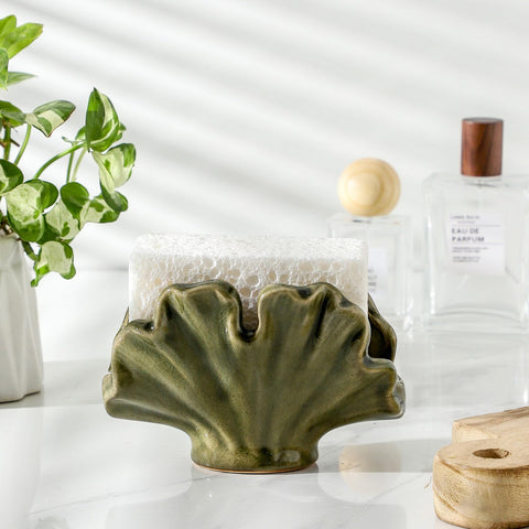 Uiddo green farmhouse sink organizer keeps scrubbers within reach.
