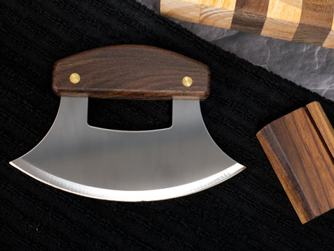 Walnut knife stand included with the Alaskan Ulu for display and storage.