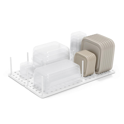 Umbra Peggy adjustable tray showing customizable storage for containers and utensils