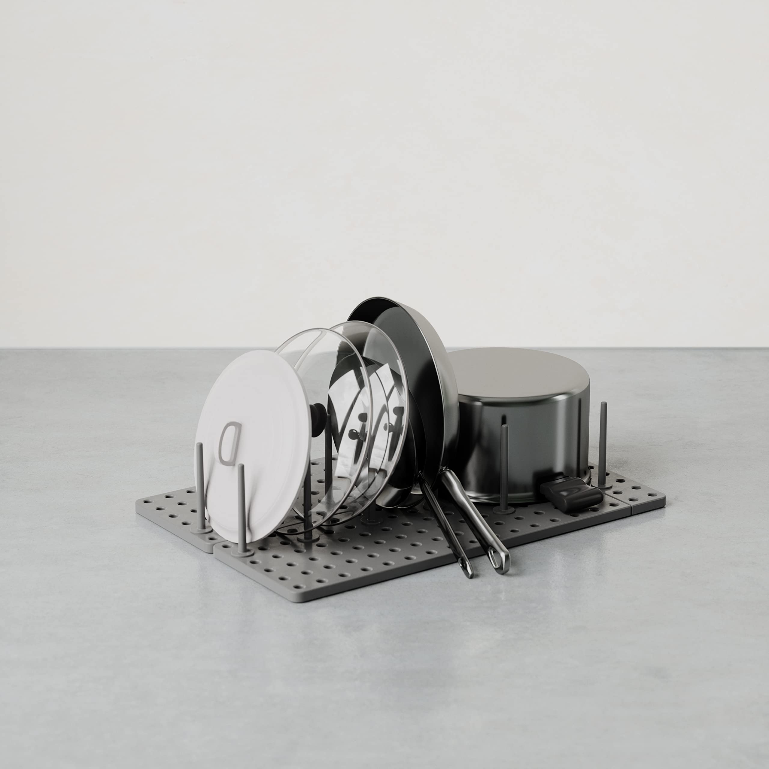 Peggy peg configuration adapts to containers and cookware for flexible storage