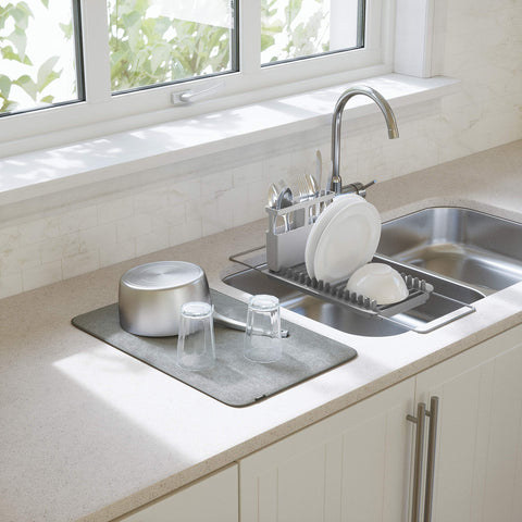 Umbra UDry microfiber drying mat absorbs moisture on the counter.