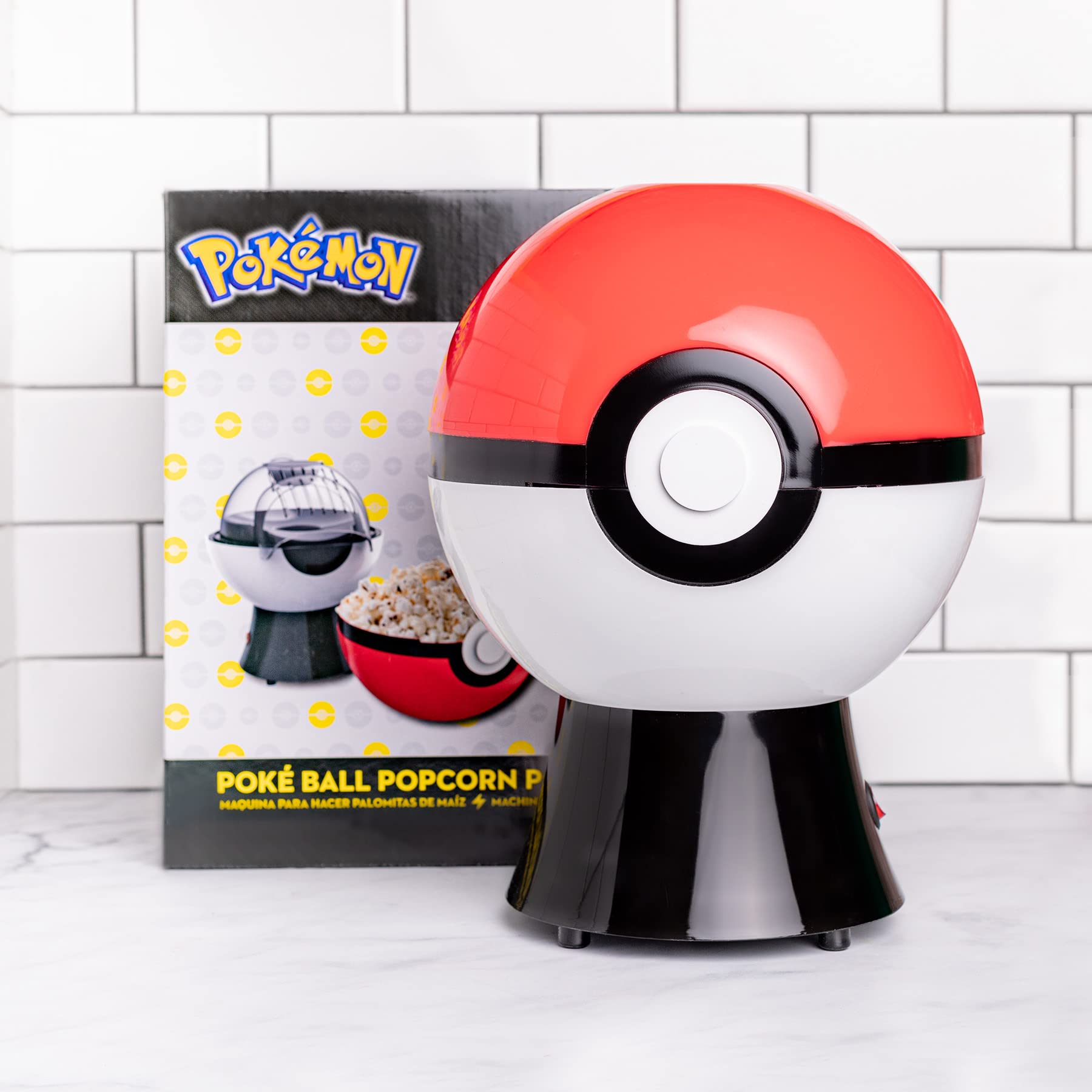 Uncanny Brands Poké Ball popcorn maker ideal for family snacks and movie nights.