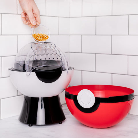 Uncanny Brands Poké Ball popcorn maker lid doubles as a serving bowl.