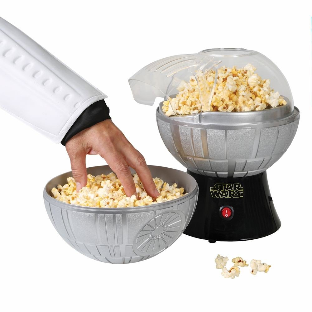 Uncanny Brands Death Star popcorn maker with measuring cup makes kernel loading simple.