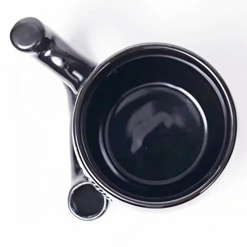 unkzyzn Wake and Bake mug is microwave-safe black mug for quick reheats.