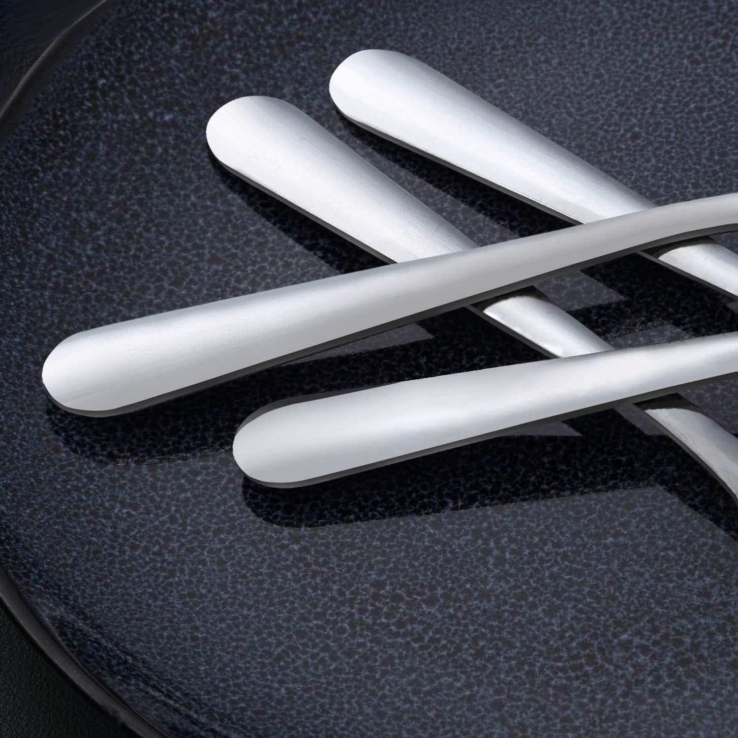 Unokit spoons on dining table showing versatility for soups and desserts
