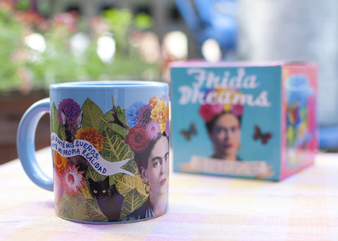 Floral, monkey, and bird motifs decorate the Frida Kahlo Dreams Mug.