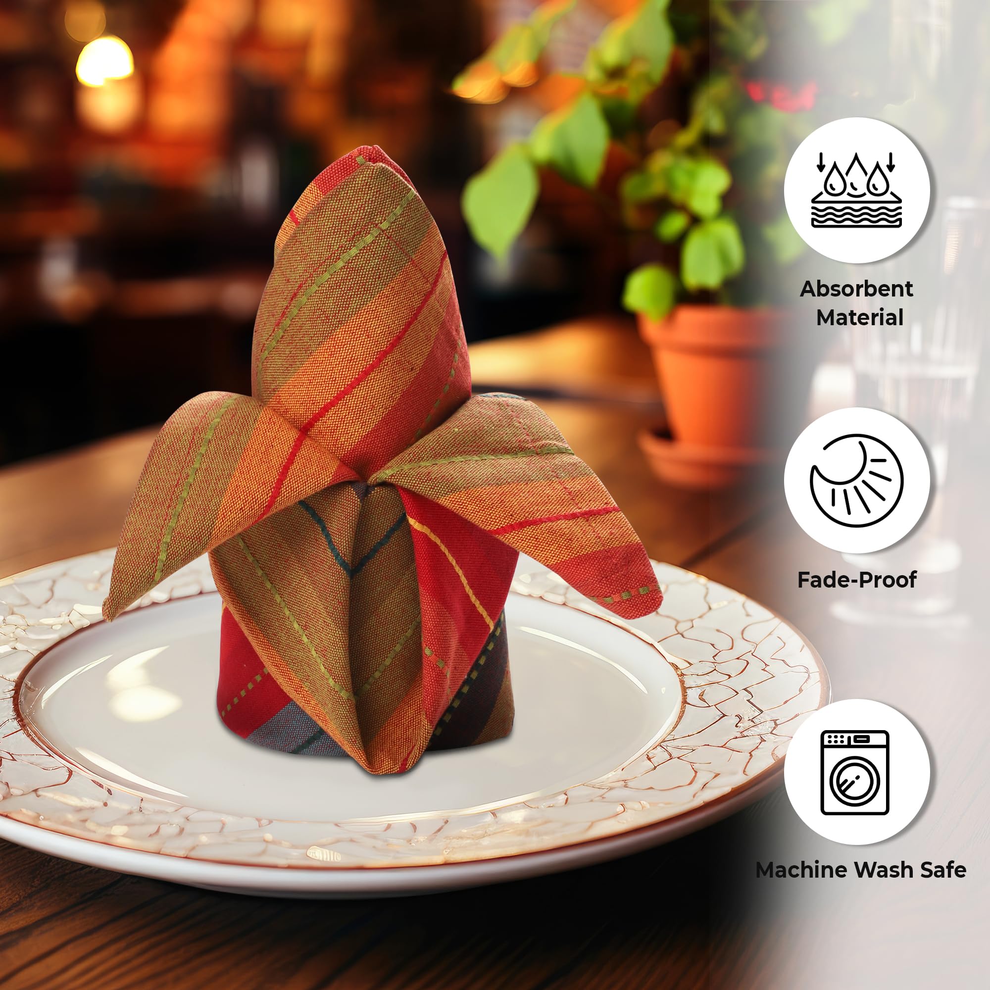 Urban Villa napkins on a dining table, vibrant stripes, reusable elegance.