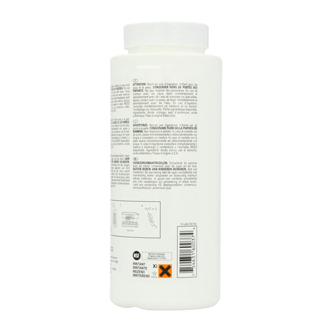 Urnex Dezcal dissolving action showing powder dissolving in water for cleaning.