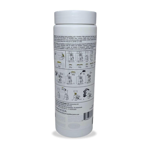 Close-up of Urnex SuperGrindz tablets for brewing and cleaning coffee burrs.