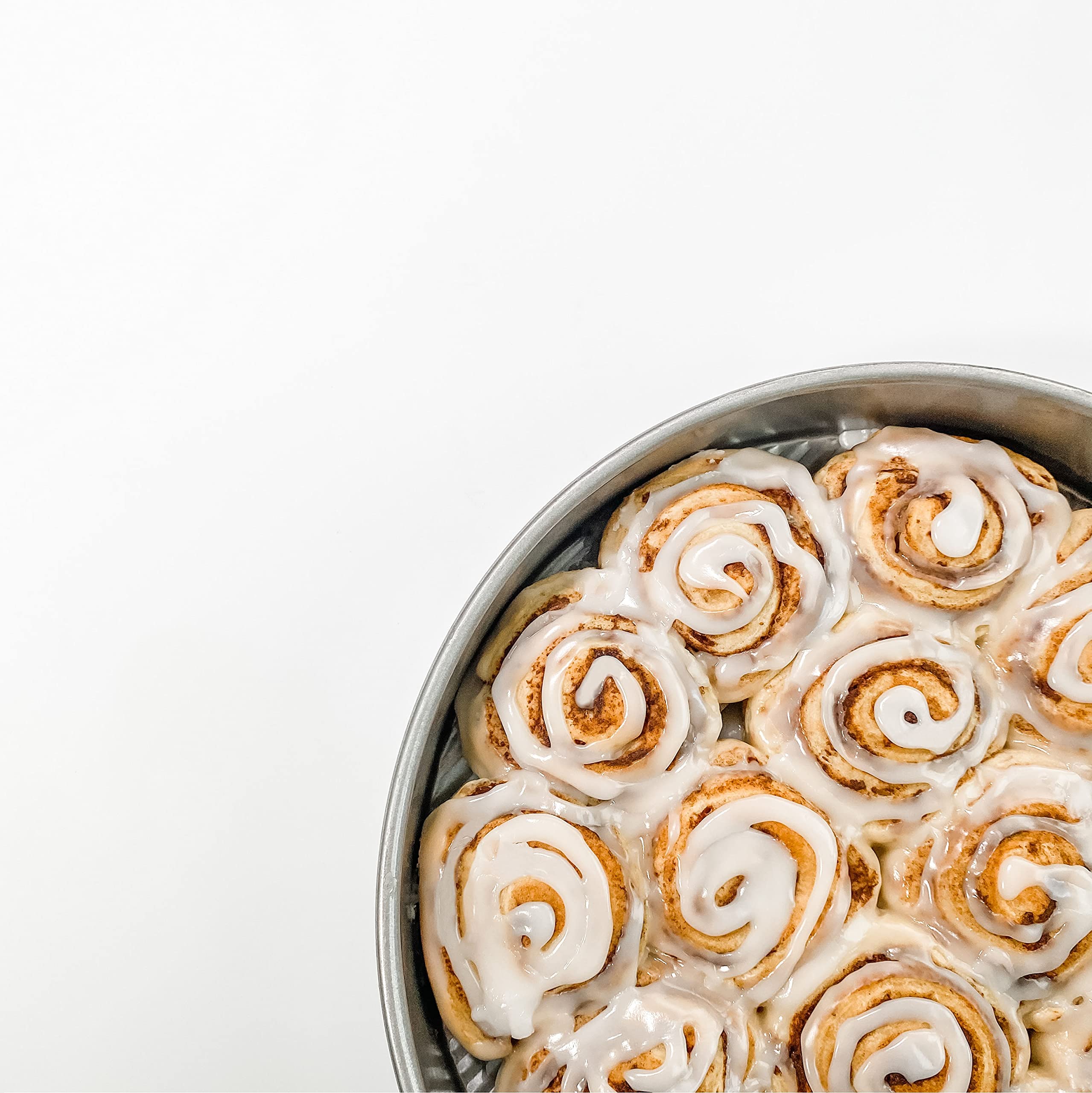USA Pan 8-inch round cake pan with fluted surface for improved air circulation and strength.