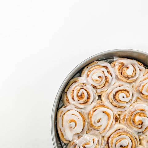 USA Pan 8-inch round cake pan with fluted surface for improved air circulation and strength.