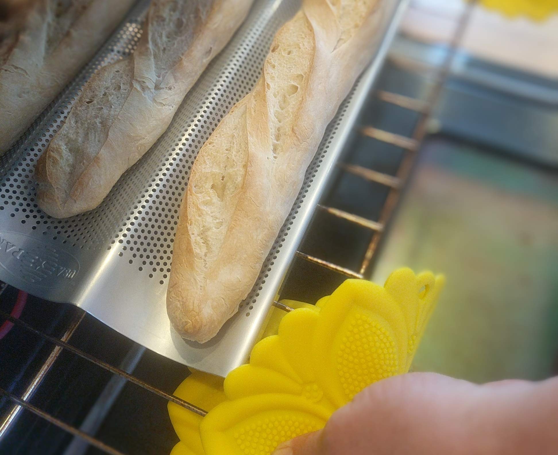 Aluminum construction delivers quick, even heat for consistent baguette texture.