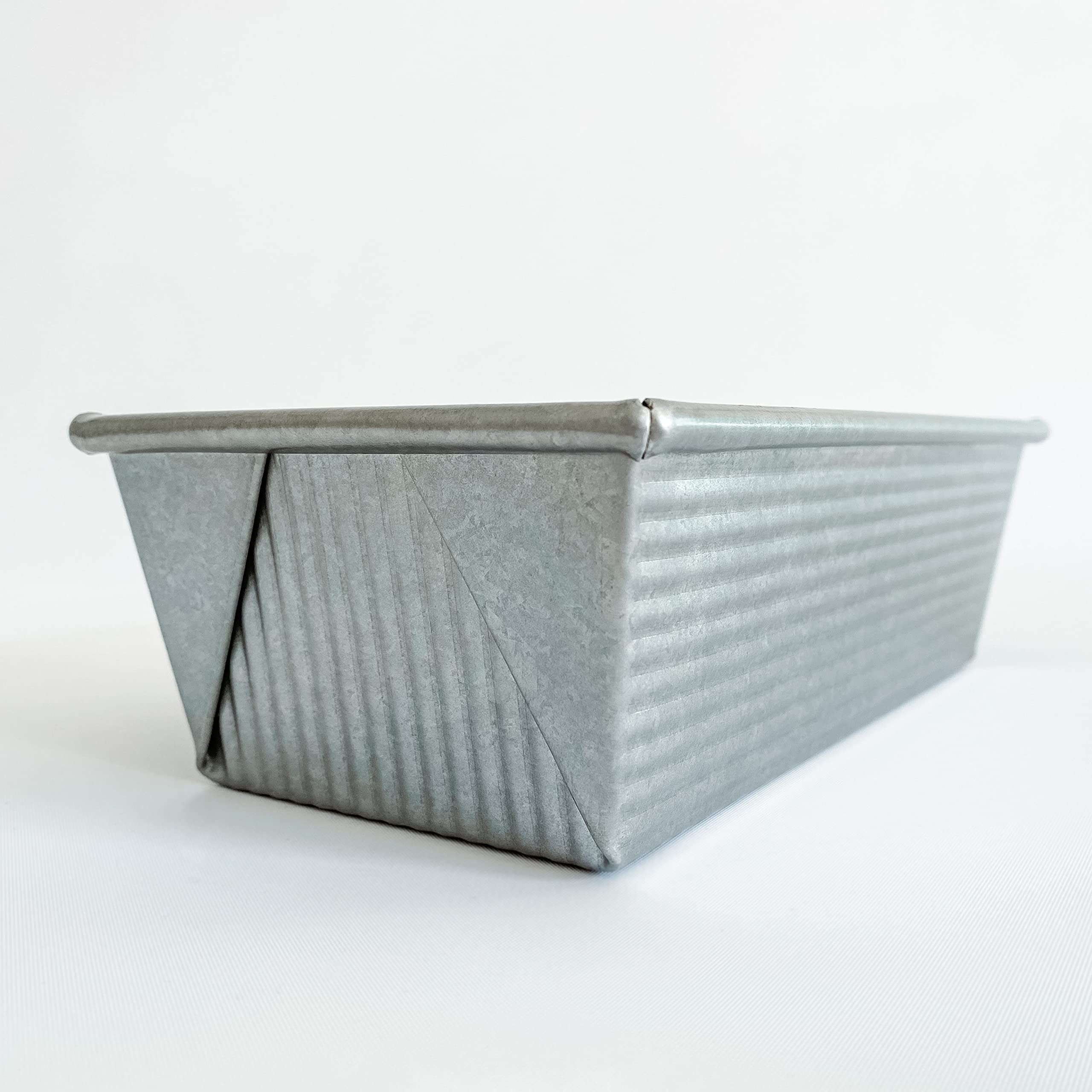 USA Pan loaf pan side view highlights sturdy aluminized steel construction and warp resistance.