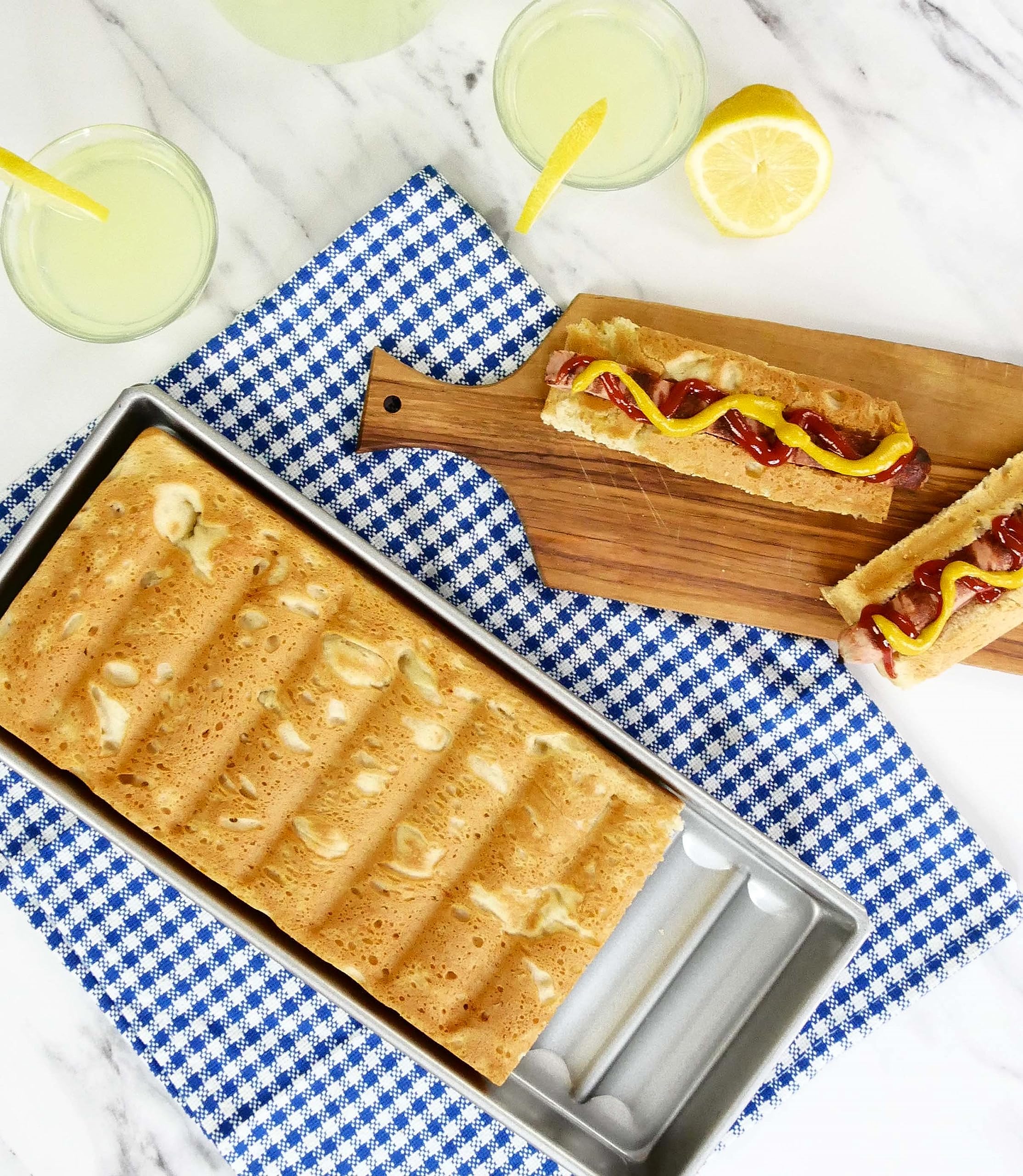 USA Pan New England hot dog bun pan with rolled edges for durability.