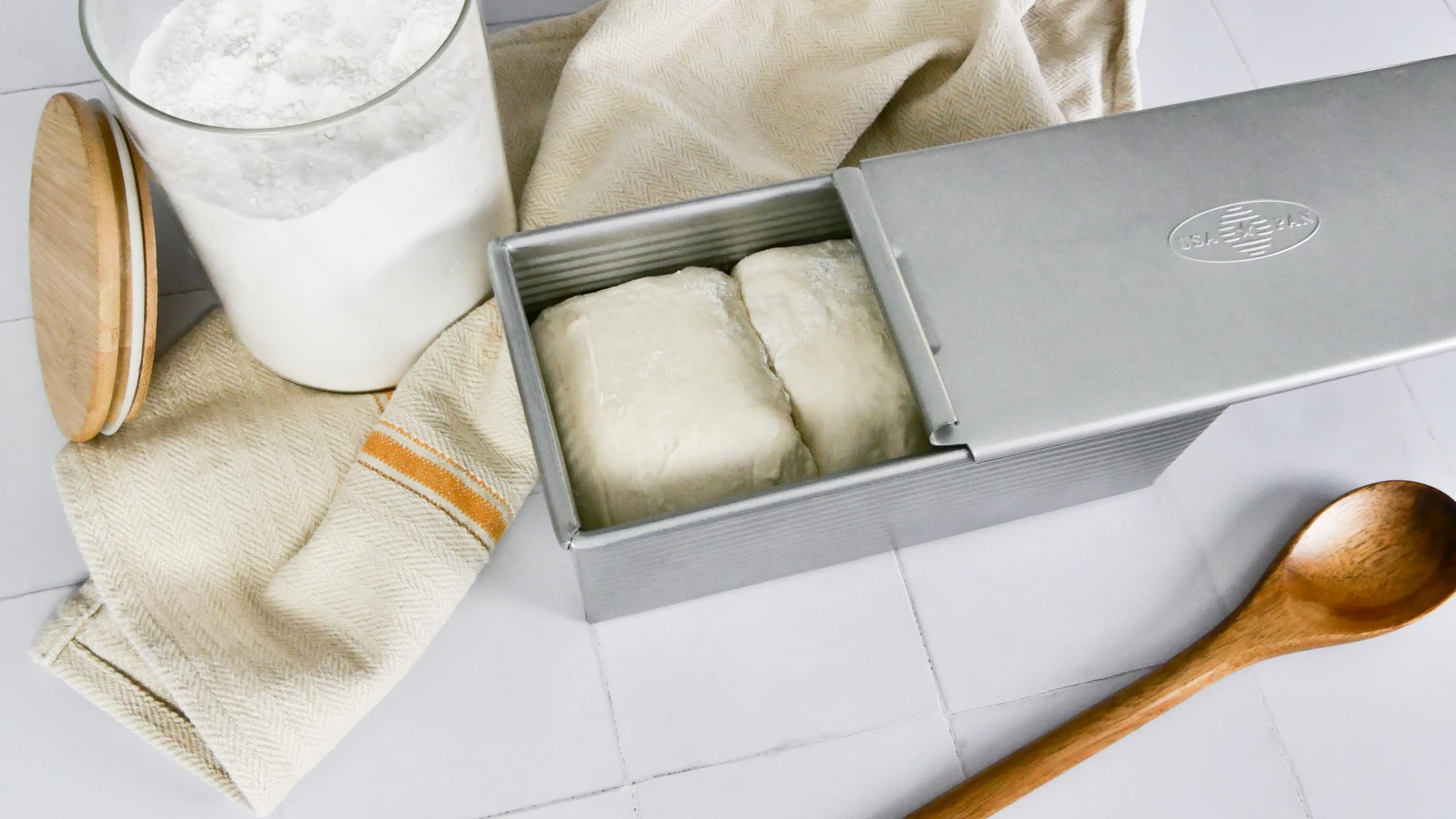 USA Pan Pullman aluminized steel body provides even heat for consistent baking