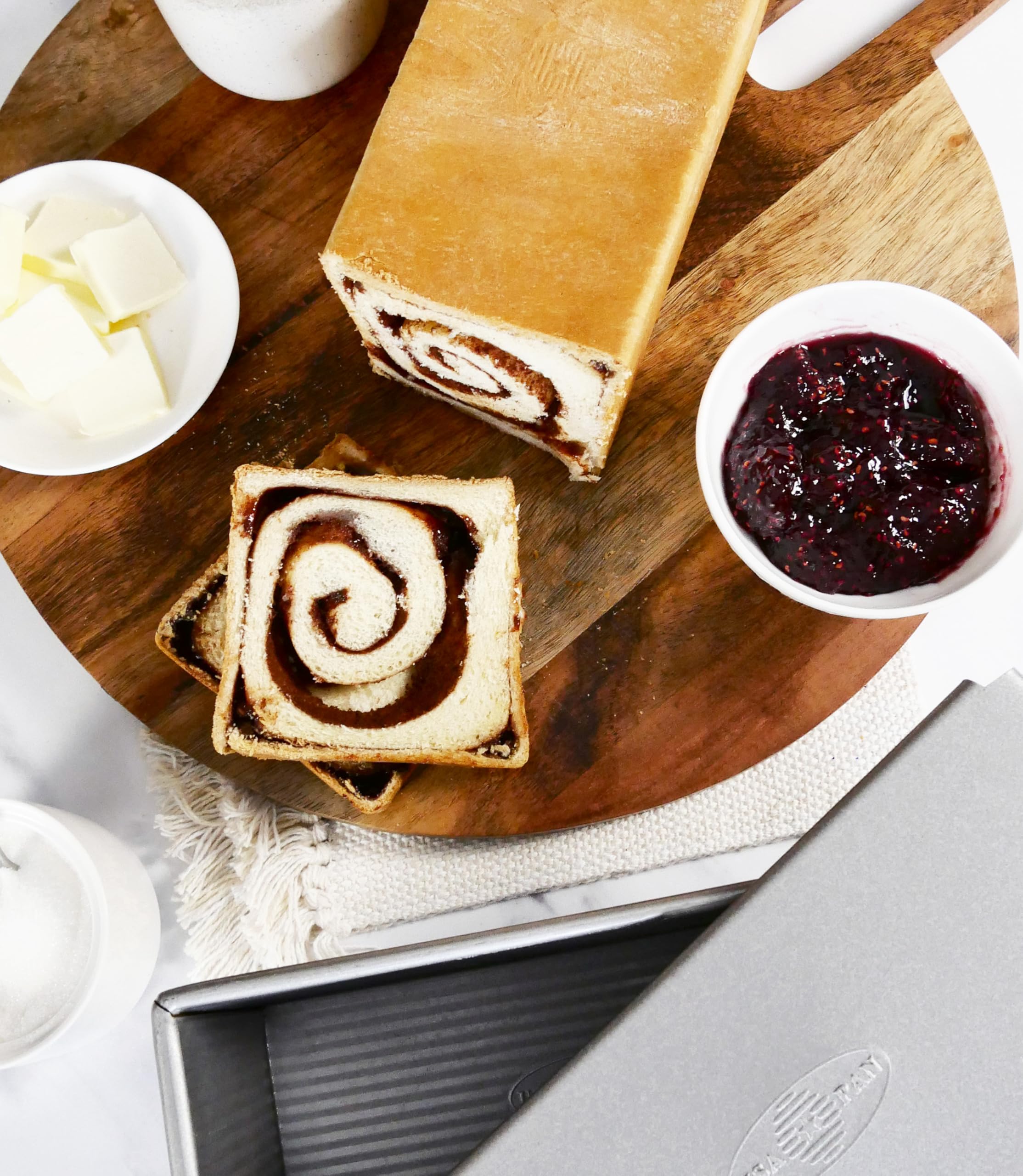 Large 9 x 4 inch surface yields well-formed square loaves
