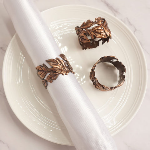 Close-up of Utalek bronze leaf napkin ring showing smooth edge