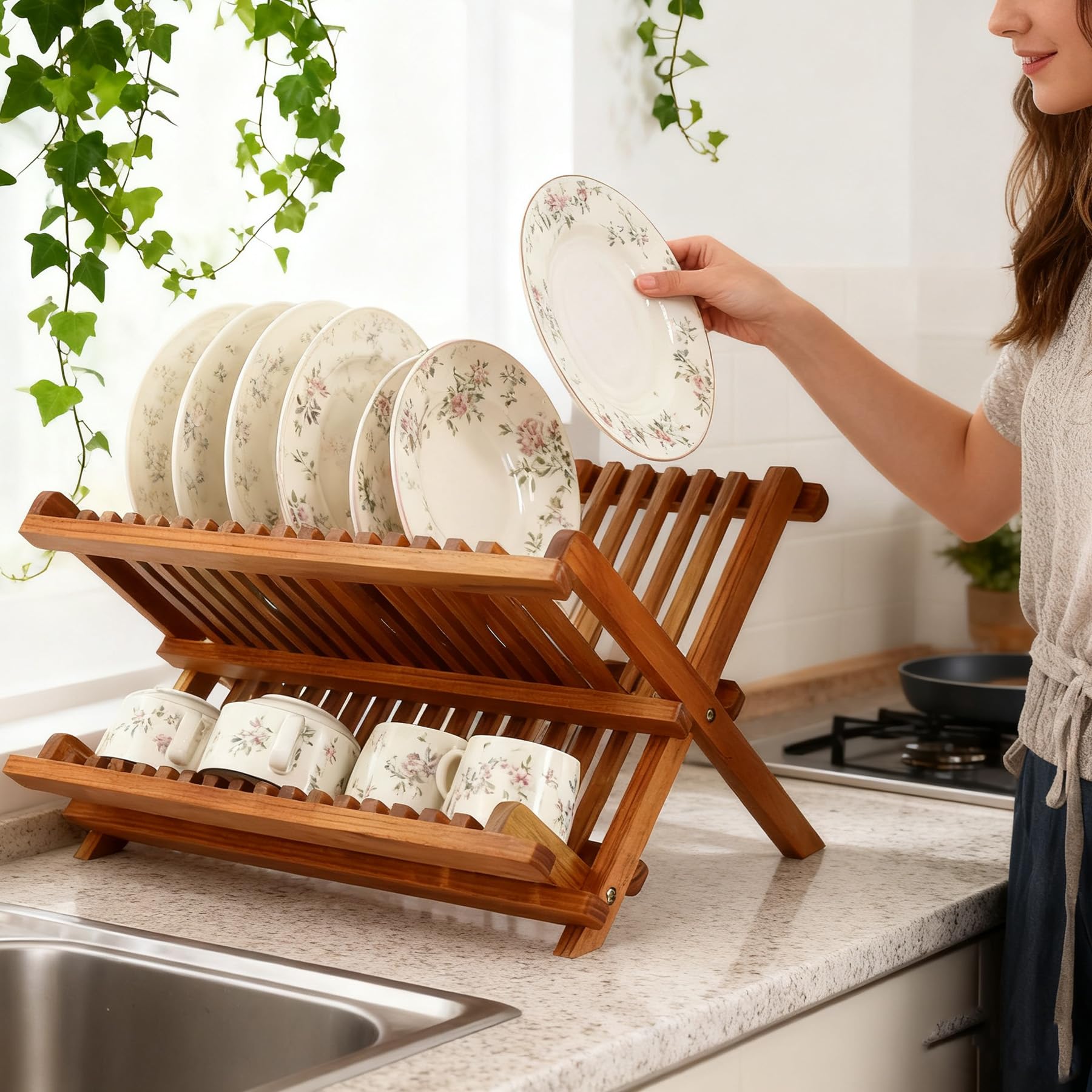 Utoplike teak dish rack top tier for plates, bottom tier for cups.