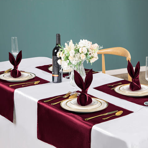 VACVELT Burgundy satin napkins closeup showing smooth texture and shine.