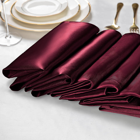 VACVELT Burgundy satin napkins neatly edged for seamless table decoration.