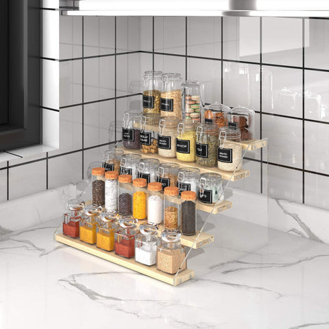 Spices and small bottles neatly arranged on VAEHOLD rack in cabinet or pantry