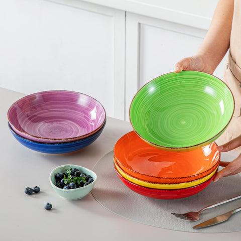 Vancasso Bonita bowls beside utensils in a modern dining setup.