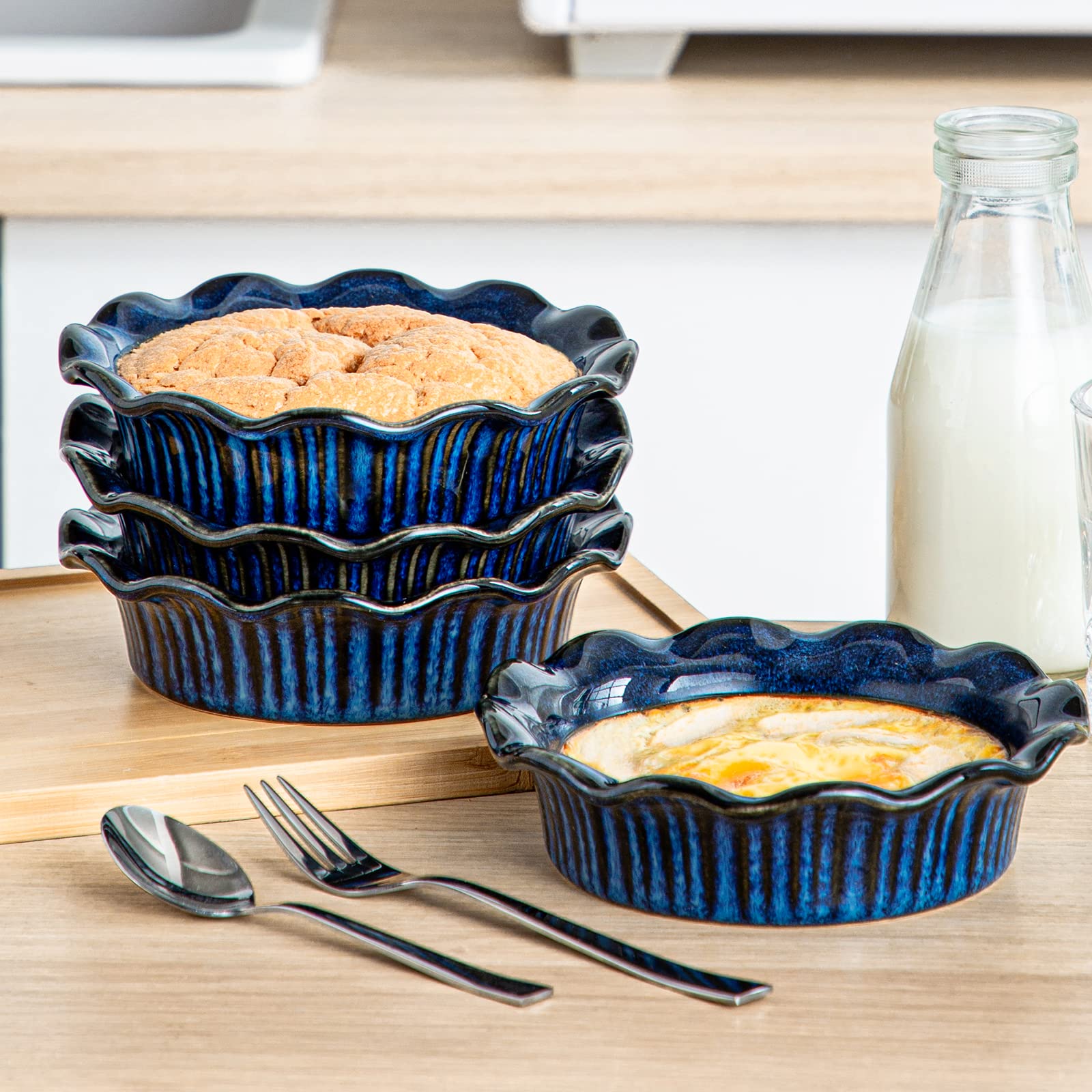 Vancasso mini pie pans in use, showcasing rustic blue finish