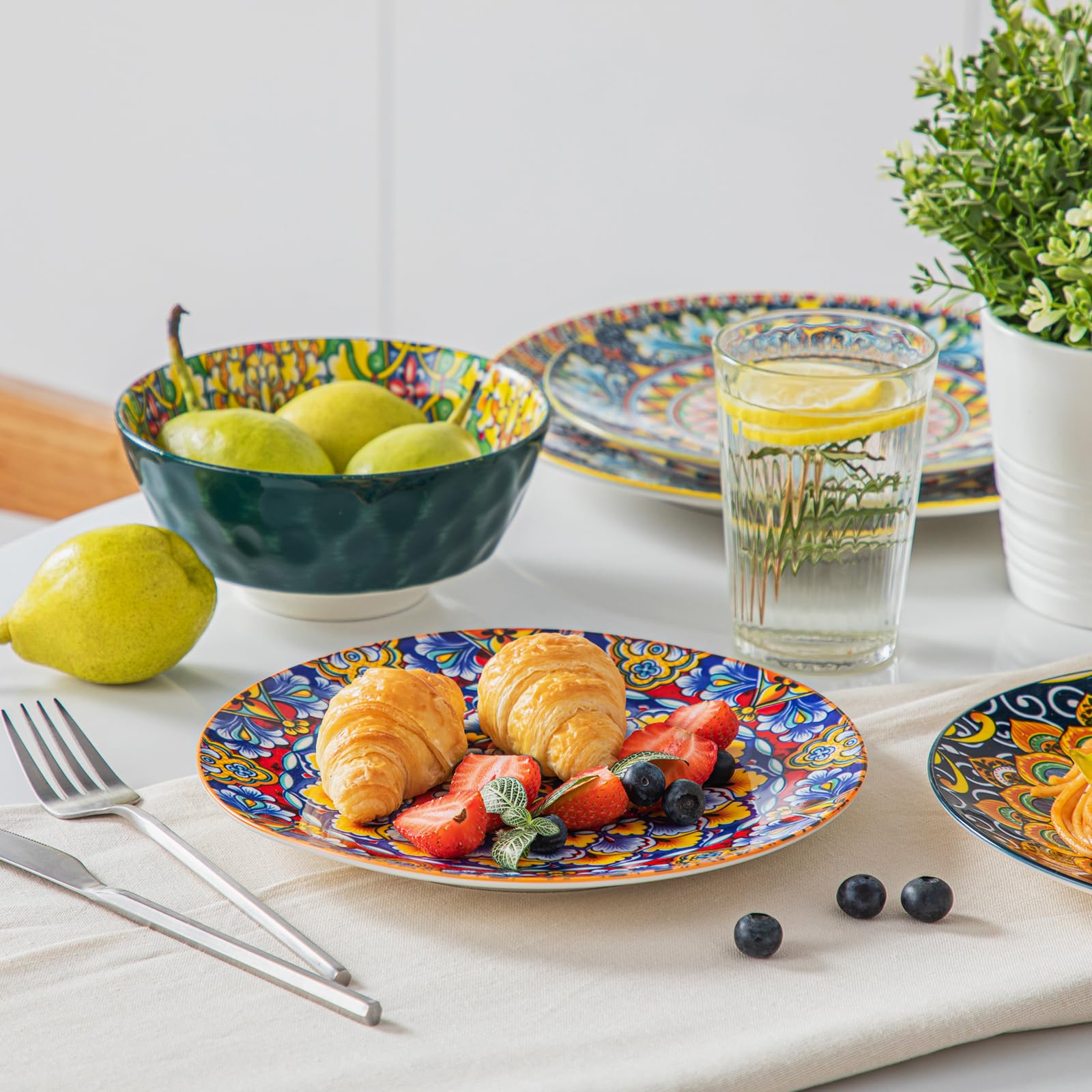 Vancasso Simi plates used as wall decor in a boho-style kitchen.