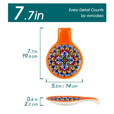 Vancasso orange spoon rest on stove top adds colorful kitchen decor.